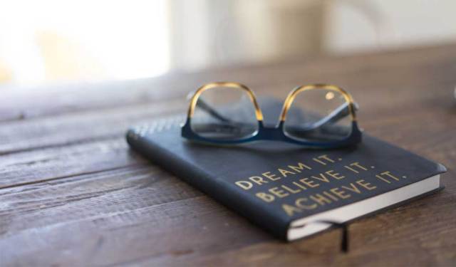 sunglasses on top of a book